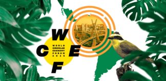Logotipo do Fórum Mundial de Economia Circular (WCEF 2025), com a letra W em destaque, sobreposto a uma imagem de uma cidade e uma ponte, com folhas verdes e um pássaro amarelo ao redor.