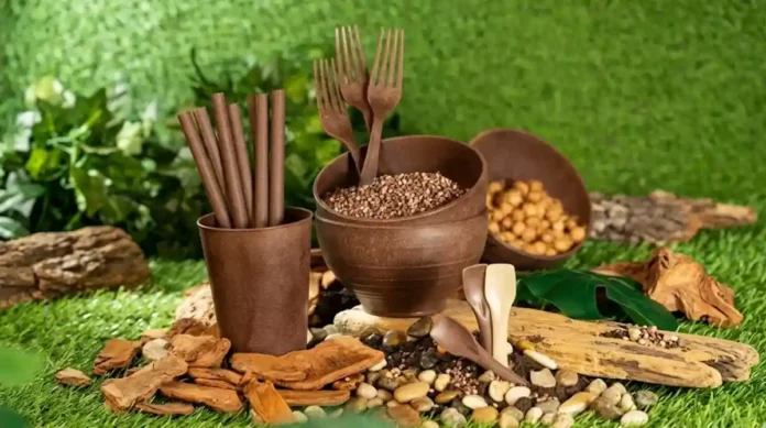 segurando grânulos de bioplástico marrom